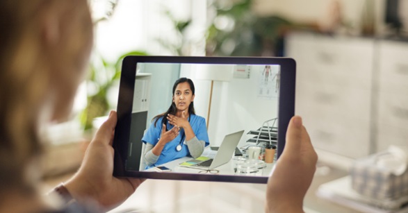 Patient uses tablet for televisit